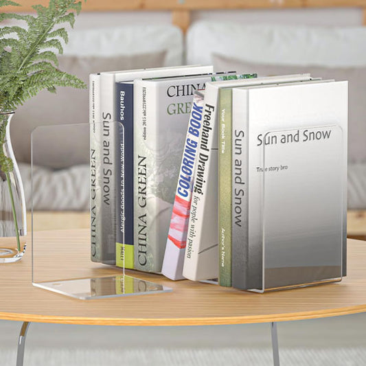 serre livre acrylique transparent poser sur une table et des livres